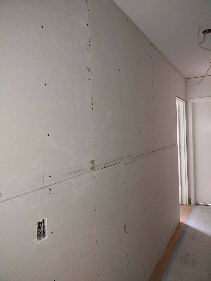 picture of a home getting drywall installed