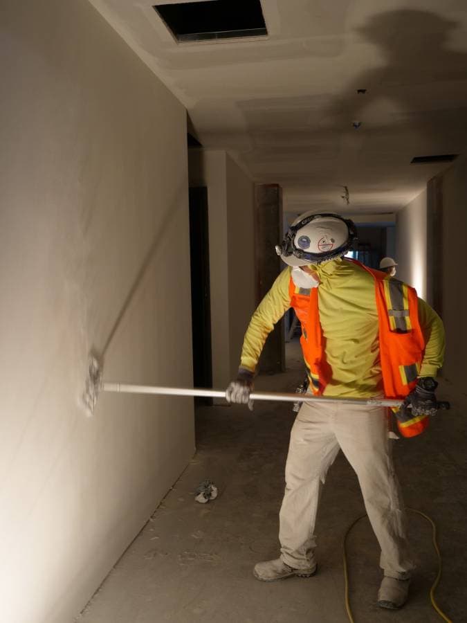 picture of drywall being painted